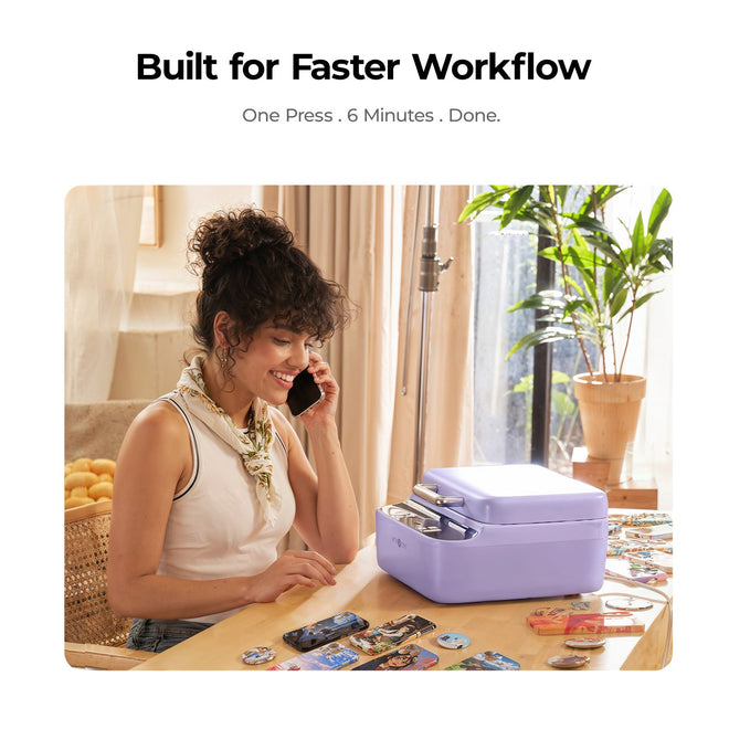 Woman on phone with a purple heat press on a desk, text 'Built for Faster Workflow'.